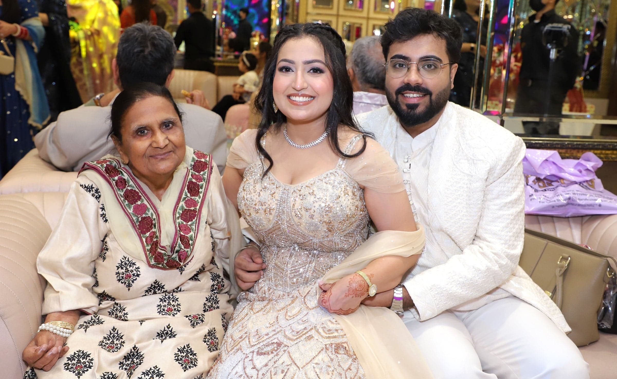 Disha and Mayank at the roka with an elder of the family